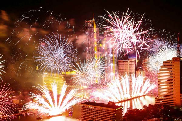 Fireworks explode over Chao Phraya River during the New Year celebrations in Bangkok, Thailand on Monday.