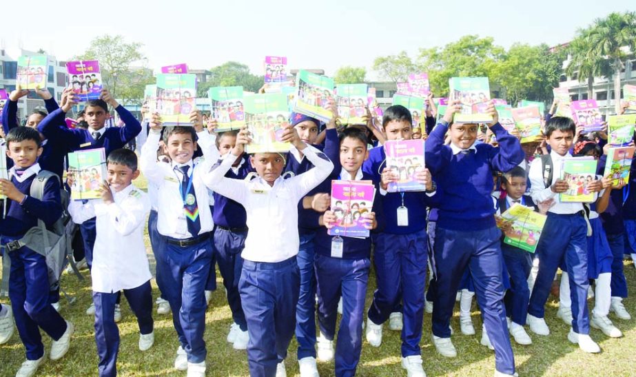 BOGURA: Jubilant students of RDA Laboratory School and College rejoicing after getting new Text book on the occasion of the Textbook Festival yesterday. Photo: Milon Alam