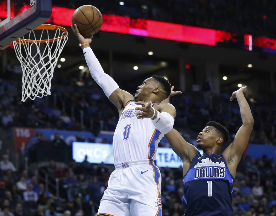 Oklahoma City Thunder guard Russell Westbrook (0) shoots in front of Dallas Mavericks guard Dennis Smith Jr. (1) in the second half of an NBA basketball game in Oklahoma City on Monday.