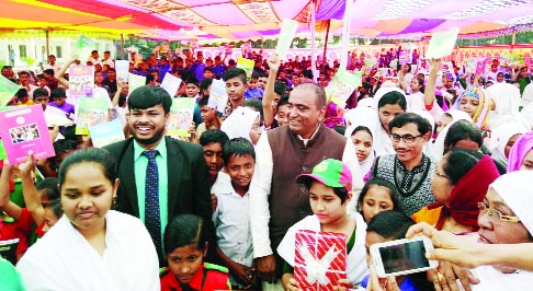 BHOLA: Newly- elected Member of Parliament Ali Azam Mukul from Bhola -2 Seat distributed new textbooks among the students marking the Textbook Festival at Borhanuddin Upazila on Tuesday.