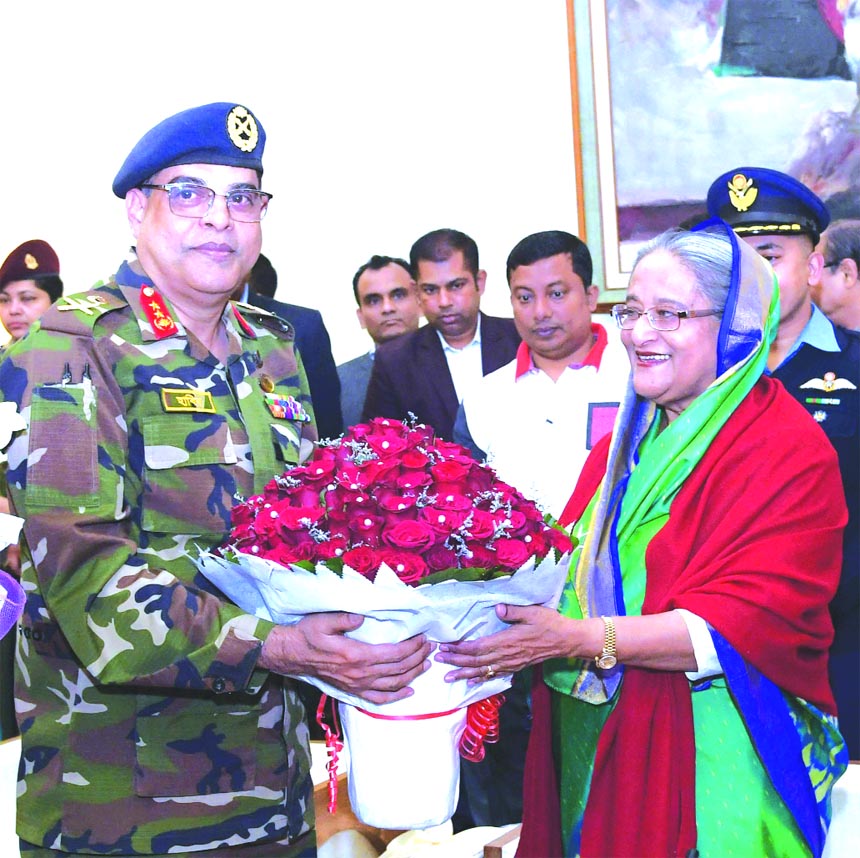 Major General Mohd Habibur Rahman Khan, Executive Chairman of Bangladesh Export Processing Zones Authority (BEPZA) on behalf of the employees of the organization, congratulating Prime Minister Sheikh Hasina with flowers for landslide victory in the 11th p