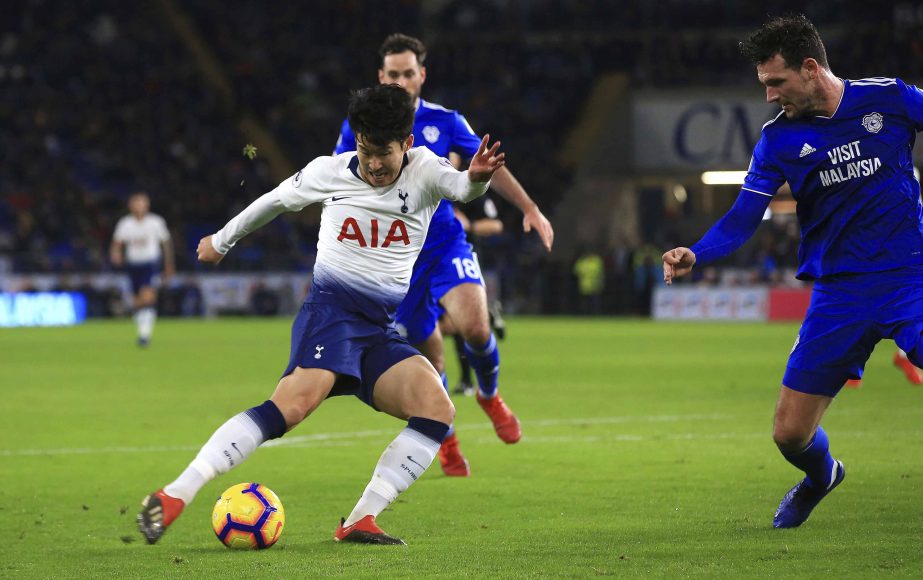 Tottenham Hotspur's Son Heung-min takes a shot to score his side's third goal of the game against Cardiff, during their English Premier League soccer match at Cardiff City Stadium in Cardiff, Wales on Tuesday.