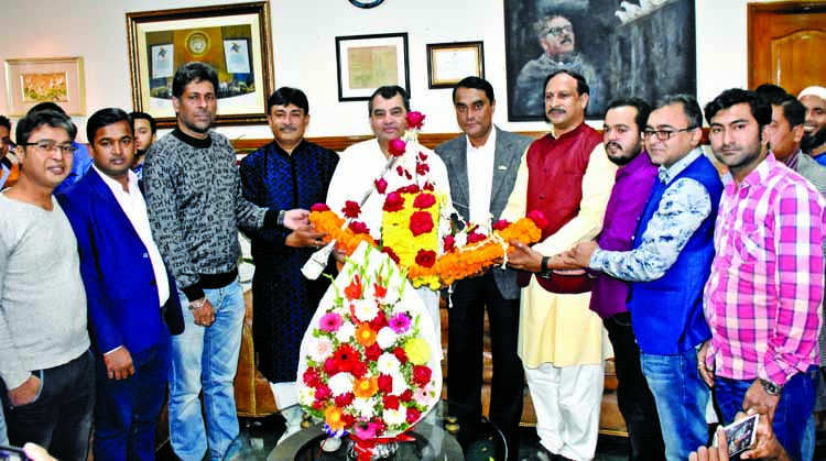 General Secretary of Dhaka Dakshin Swechchhasebak League Arifur Rahman Titu along with other leaders and activists of the party greet Saber Hossain Chowdhury by giving bouquet for his victory in Dhaka-9 constituency in the eleventh parliamentary electio