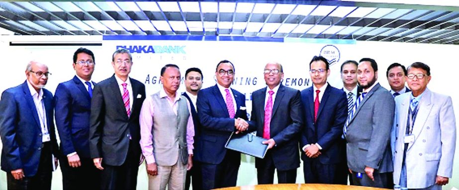 Syed Mahbubur Rahman, Managing Director & CEO of Dhaka Bank Limited and Shib Narayan Kairy, Treasurer of BRAC University, exchanging an agreement signing documents at the university campus on Tuesday. Under the deal, students of the university can pay the