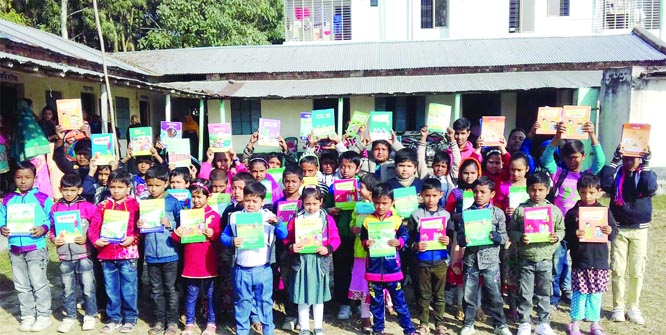 DUPCHANCHIA (Bogura): Students of Dupchanchia Sammilito Pre-Cadet School showing their new textbooks at the Textbook Festival on Tuesday.