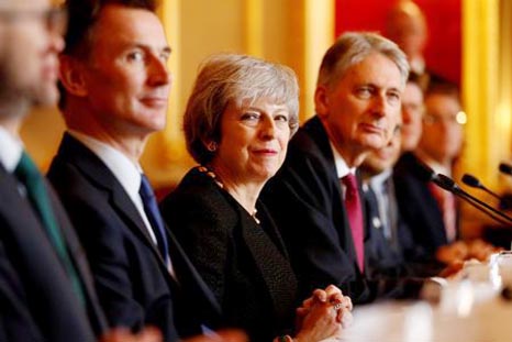 Britain's Prime Minister Theresa May sits with members of her cabinet, including Secretary of State for Defence Gavin Williamson, Secretary of State for Foreign and Commonwealth Affairs Jeremy Hunt, Chancellor of the Exchequer Philip Hammond, Secretary o