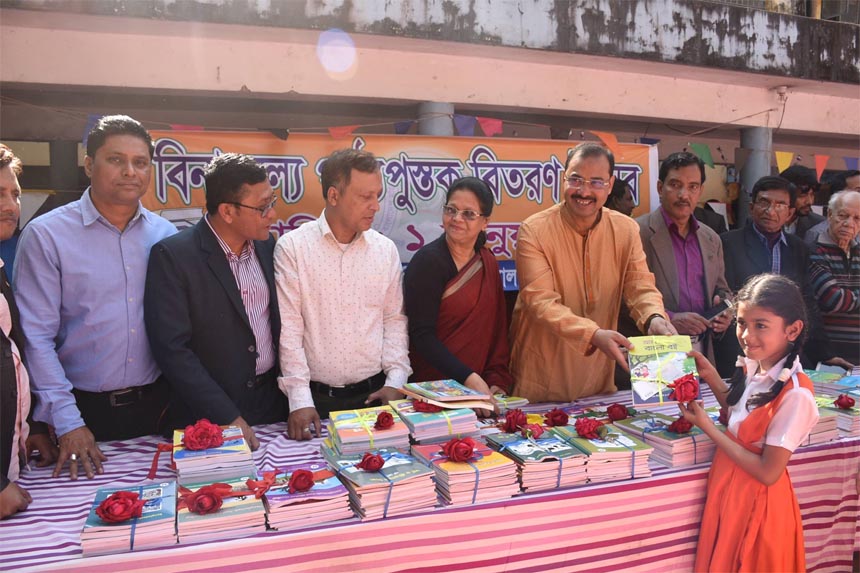 CCC Mayor A J M Nasir Uddin distributing new textbooks among the students at Chattogram marking the Textbook Festival recently.