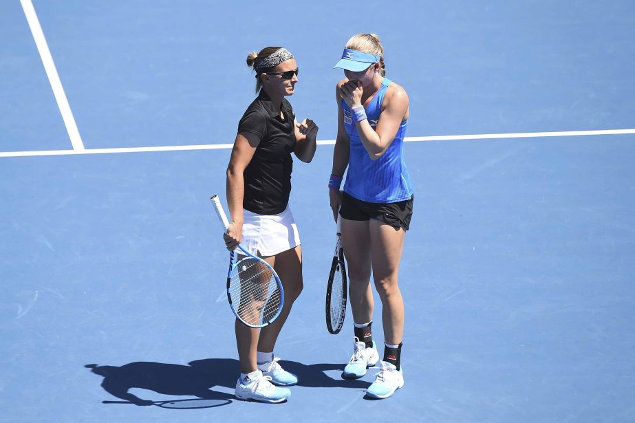 Belgium's Kristen Flipkens (left) and Sweden's Johanna Larsson chat during the doubles semifinals of the ASB Classic women's tennis tournament in Auckland, New Zealand on Saturday.