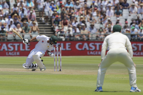 Pakistan batsman Shan Masood ducks to avoid a bouncer on day three of the second cricket Test match between South Africa and Pakistan at Newlands Cricket Ground in Cape Town, South Africa on Saturday.