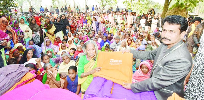 DINAJPUR: Shah Mohammad Anwar Hossain, General Secretary, Awami League, Sundarban Union distributing winter clothes among the cold- hit people on Saturday.