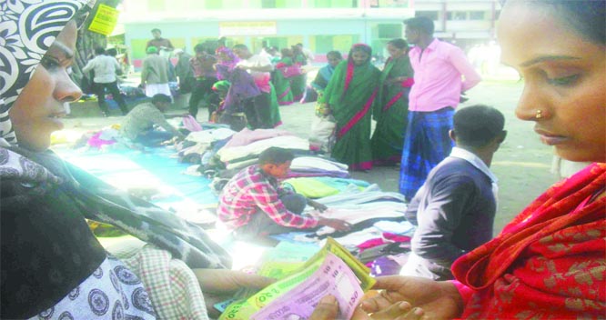 SUNDARGANJ (Gaibandha): People at Sunadrganj Upazila rushing for winter clothes shopping at Upazila premises yesterday .