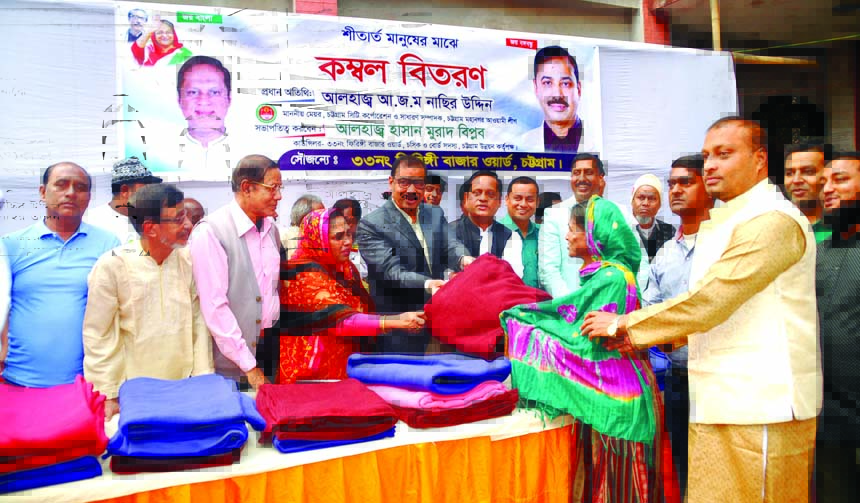 CCC Mayor AJ M Nasir Uddin distributing blankets among the cold- hit people at Giringi Bazar Ward as Chief Guest recently.