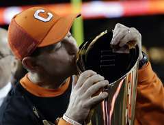 Clemson head coach Dabo Swinney kisses the championship trophy after the NCAA college football playoff championship game against Alabama on Monday.