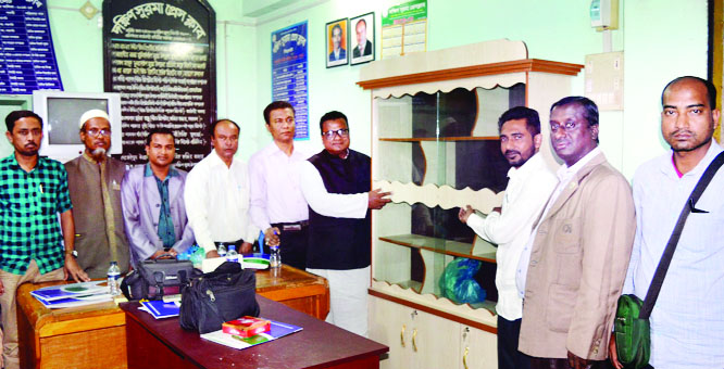 SYLHET: Md Chhyef Khan, General Secretary , Awami League of Ward No 27 giving bookshelves to the leaders of South Surma Press Club recently.