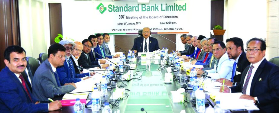 Kazi Akram Uddin Ahmed, Chairman, Board of Directors of Standard Bank Limited, presiding over its 306th meeting at the Banks head office in the city on Monday. Mamun-Ur-Rashid, Managing Director, Mohammed Shamsul Alam, Vice-Chairman, Kamal Mostafa Chowdhu