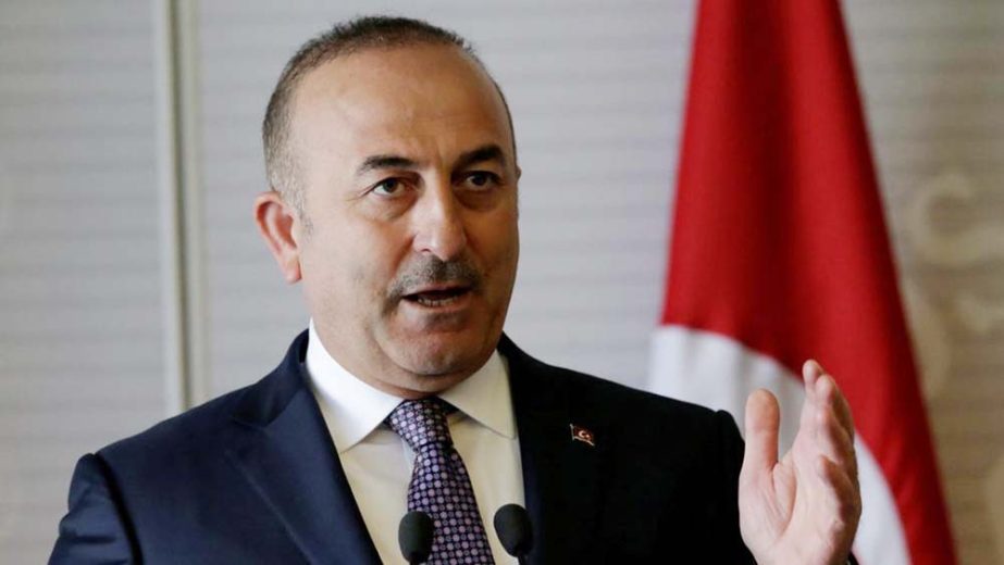 Turkey's Foreign Minister Mevlut Cavusoglu listens at the parliament in Ankara, Turkey on Tuesday