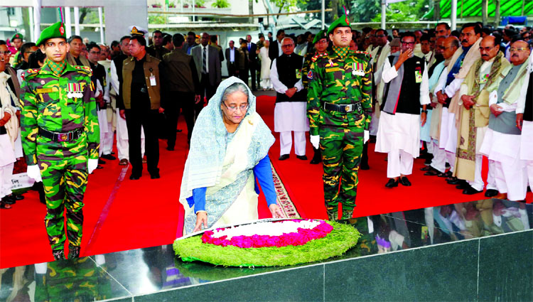 Marking the Bangabandhu's Home-coming Day, Prime Minister Sheikh Hasina placing wreaths at the portrait of Bangabandhu at Dhanmondi on Thursday.