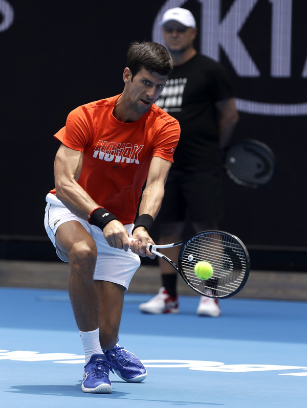 Serbia's Novak Djokovic makes a backhand return to Britain's Andy Murray during a practice match on Margaret Court Arena ahead of the Australian Open tennis championships in Melbourne, Australia on Thursday.