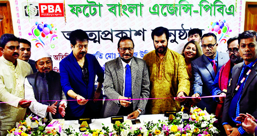 Chairman of Bangladesh Press Council Justice Mamtaj Uddin inaugurating the debut of Photo Bangla Agency (PBA) by cutting ribbon at its office in the city's Uttara on Friday.