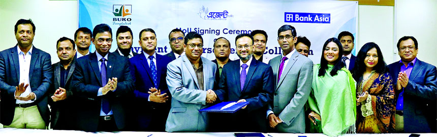 Sardar Akhter Hameed, Head of Channel Banking of the Bank Asia Limited and Mosharrof Hosain, Director (Finance) of BURO Bangladesh, exchanging a MoU signing documents regarding micro-credit disbursement and collection from beneficiaries of BURO Bangladesh