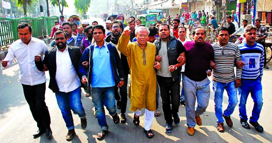 BNP leaders and workers brought out a procession in city's Fakirerpool area on Friday demanding scrapping of 11th Parliamentary election and early release of BNP Chairperson Begum Khaleda Zia.