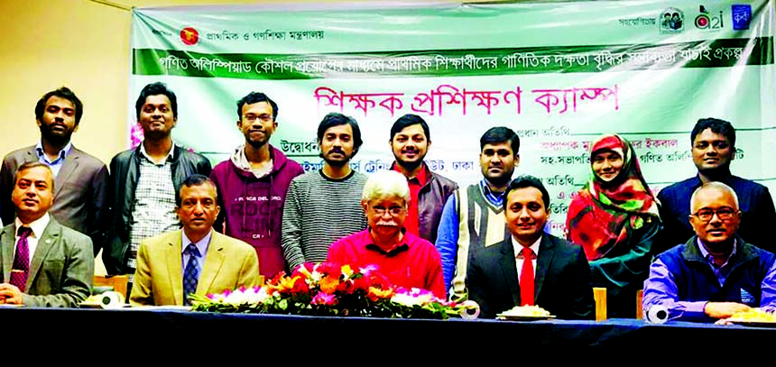 Noted Educationist Professor Dr Zafar Iqbal along with guests poses for a photo session titled "Teachers Training Camp' organised by the Primary and Mass Education Ministry with a view to implementing their experiences to increase skill of the primary"