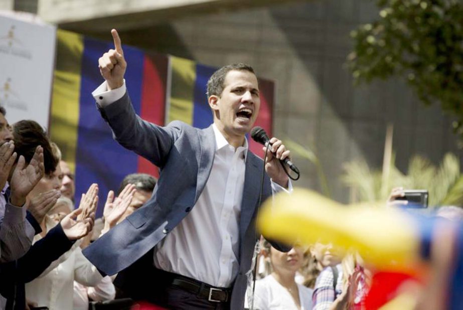 Juan Guaido, President of the Venezuelan National Assembly delivers a speech during a public session with opposition members, at a street in Caracas, Venezuela on Friday
