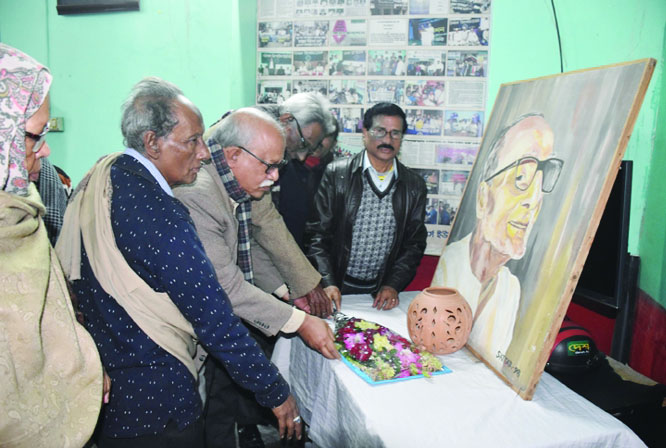 BARISHAL: Leaders of Debendranath Ghosh Smriti Rakkha Commiittee placing wreaths at the portrait of renowned politician Debendranath Ghosh marking the 20th death anniversary of the scholar at Barishal Reporters' Unity on Friday .
