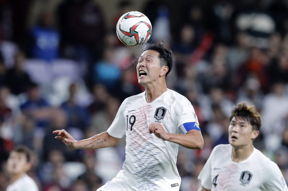 South Korea's defender Kim Young-Gwon heads the ball during the AFC Asian Cup group C soccer match between Kyrgyzstan and South Korea at Hazza Bin Zayed Stadium in Al Ain, United Arab Emirates on Friday.