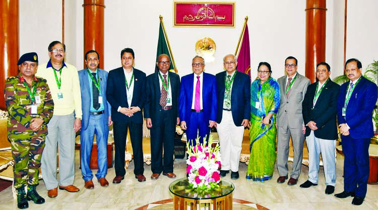 President M Abdul Hamid seen in a photo session with the delegation of Bangabandhu Sheikh Mujib Medical University at Bangabhaban yesterday. Photo: Bangabhaban Press Wing