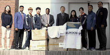 South Korean Ambassador to Bangladesh Hu Kang IL handing over the Taekwondo equipment to Mahmudul Islam Rana, General Secretary of Bangladesh Taekwondo Federation at South Korean Embassy in the city's Baridhara on Sunday.