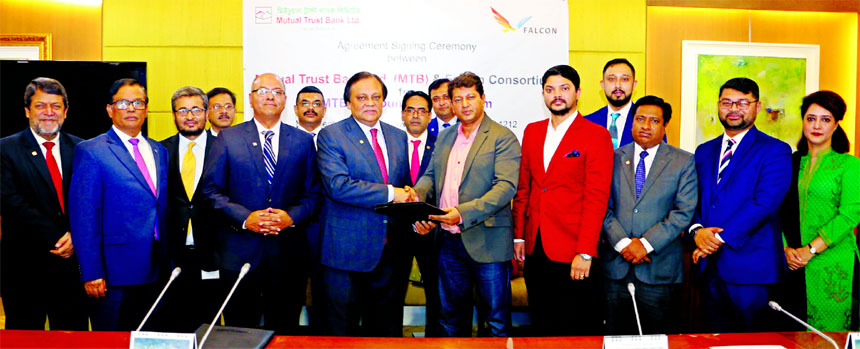 Mahfuz Ahmed and Sayed A. Amin, Joint Venture Partners of Falcon Consortium and Anis A. Khan, Managing Director of Mutual Trust Bank Limited (MTB), exchanging an agreement signing for operation and maintenance of MTB Air Lounge at Shah Amanat Internationa