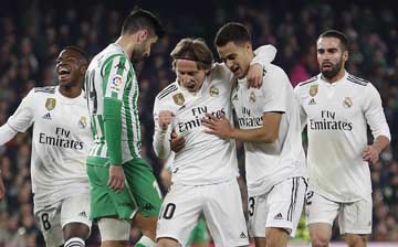 Real Madrid's Modric (center) celebrates after scoring against Betis during La Liga soccer match between Betis and Real Madrid at the Villamarin stadium in Seville, Spain on Sunday.