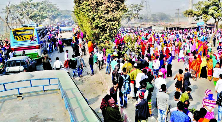Garment workers blocked Dhaka-Aricha Highway for two and a half hours and vandalised vehicles on Monday following a rumour over the death of a female worker in a road accident.