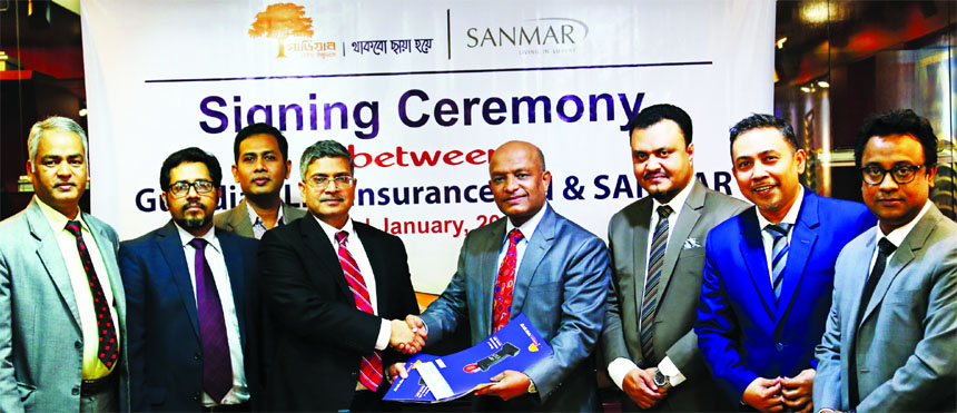 Major (Retd.) Nizam Uddin Ahmed, Chief Operating Officer (Corporate Admin & HR) of Sanmar Group and M M Monirul Alam, Managing Director of Guardian Life Limited (GLIL), exchanging an agreement signing document to ensure Group Life and Health Insurance cov