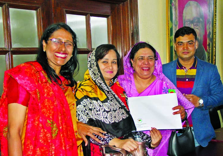 Advisory Counci member of Badalgachhi Upazila Awami League Begum Sakhina Siddique bought nomination form for the reserved women seat of the 11th parliamentary election for Naogaon district Awami League. The snap was taken from the city's Dhanmondi AL off