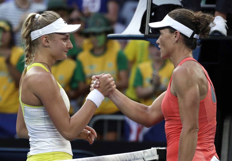 Ukraine's Dayana Yastremska (left) is congratulated by Australia's Samantha Stosur after winning their first round match at the Australian Open tennis championships in Melbourne, Australia on Tuesday.