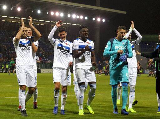 Atalanta's players celebrate at the end of the Italian Cup, quarterfinal soccer match between Cagliari and Atalanta, at the Sardegna Arena in Cagliari, Italy on Monday. Atalanta left it late to win at Cagliari 2-0 to set up an Italian Cup quarterfinal ag