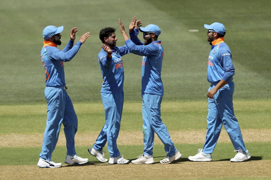 India celebrate the wicket of Australia's Usman Khawaja during their one day international cricket match in Adelaide, Australia on Tuesday.