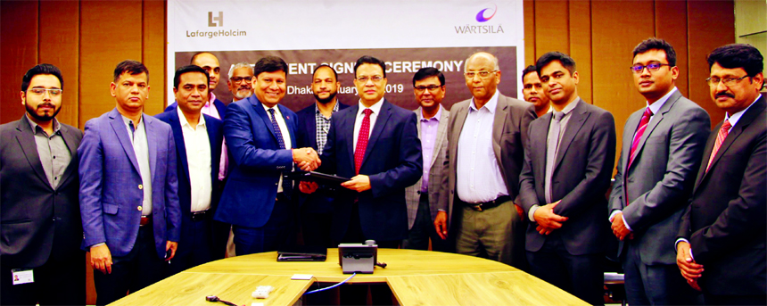 Rajesh Surana, CEO of LafargeHolcim Bangladesh Limited (LHBL) and Jillur Rahim, Managing Director of WÃ¤rtsilÃ¤ Bangladesh, exchanging an agreement signing document at LHBL head office in the city on Tuesday. Under the deal, WÃ¤rtsilÃ¤ will provid