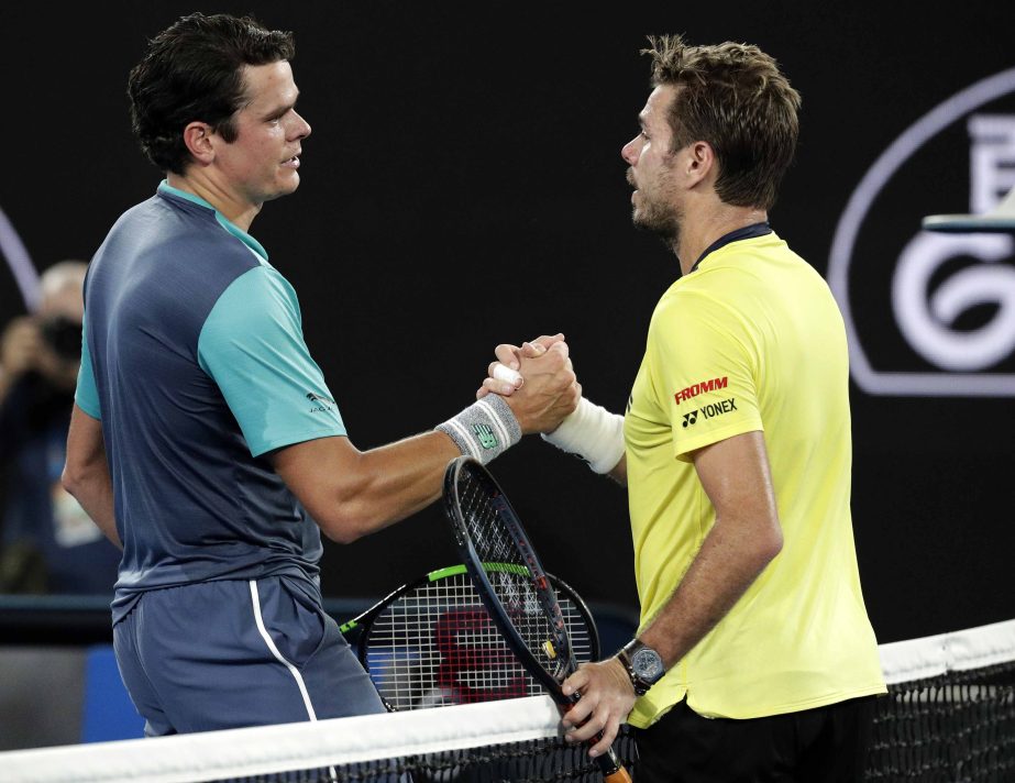 Canada's Milos Raonic (left) is congratulated by Switzerland's Stan Wawrinka after winning their second round match at the Australian Open tennis championships in Melbourne, Australia on Thursday.