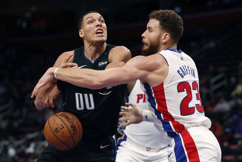 Detroit Pistons forward Blake Griffin (23) knocks the ball away from Orlando Magic forward Aaron Gordon (00) during the second half of an NBA basketball game on Wednesday.