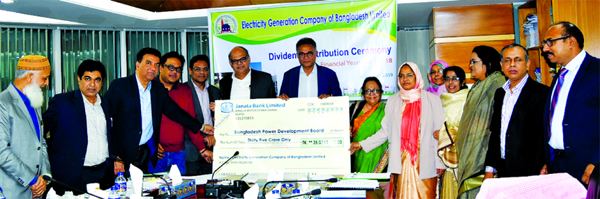 Dr Ahmad Kaikaus, Chairman of Electricity Generation Company of Bangladesh Limited (EGCB) and also Secretary of Power Division, handing over a dummy cheque of Tk. 35.00 crore to Engr. Khaled Mahmood, Chairman of Bangladesh Power Development Board at its c