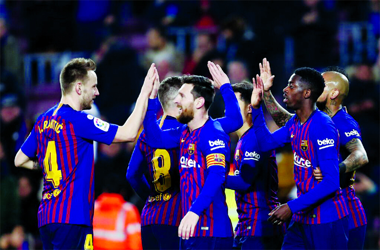 FC Barcelona's Dembele (right) celebrates after scoring with teammates his side's second goal during a Spanish Copa del Rey soccer match between FC Barcelona and Levante at the Camp Nou stadium in Barcelona, Spain on Thursday.