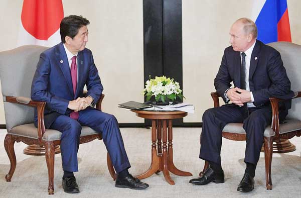 Japanese Prime Minister Shinzo Abe and Russian President Vladimir Putin attend a meeting on the sidelines of the Asean-Russia Summit in Singapore.