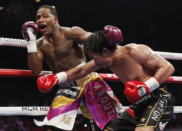 Manny Pacquiao (right) hits Adrien Broner during a WBA welterweight title boxing match in Las Vegas on Saturday.