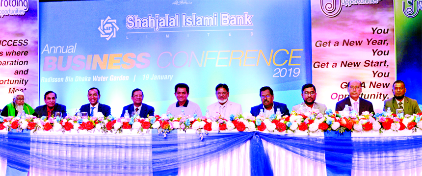 Akkas Uddin Mollah, Chairman, Board of Directors of Shahjalal Islami Bank Limited (SJIBL), presiding over its "Annual Business Conference-2019" at a hotel in the city on Saturday. Mohammed Younus, Vice-Chairman, M. Shahidul Islam, Managing Director, Md.