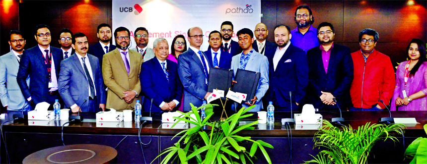 Md. Abdullah Al Mamoon, DMD of United Commercial Bank (UCB) Limited and Hussain Elius, CEO of Pathao Limited, exchanging an agreement signing documents on providing the convenience of payment for Pathao services using Upay, Digital Payment System of the