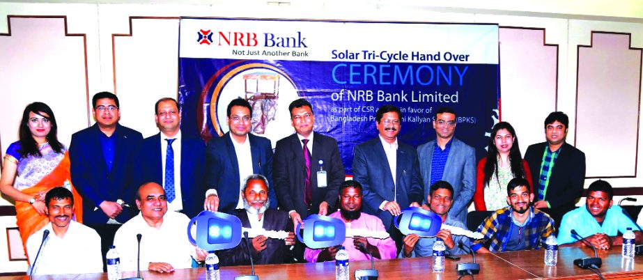 Md. Mehmood Husain, Managing Director of NRB Bank Limited, poses for a photograph after distributing the keys of the Solar Tri-Cycles to the disabled persons at BPKS, in Dakhinkhan in the city recently. Imran Ahmed, Chief Operating Officer, Mohd. Jamil H