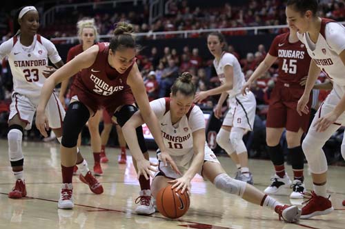 Washington State center Maria Kostourkova (20) and Stanford's Alyssa Jerome (10) chase a loose ball during the first half of an NCAA college basketball game in Stanford, Calif on Sunday.